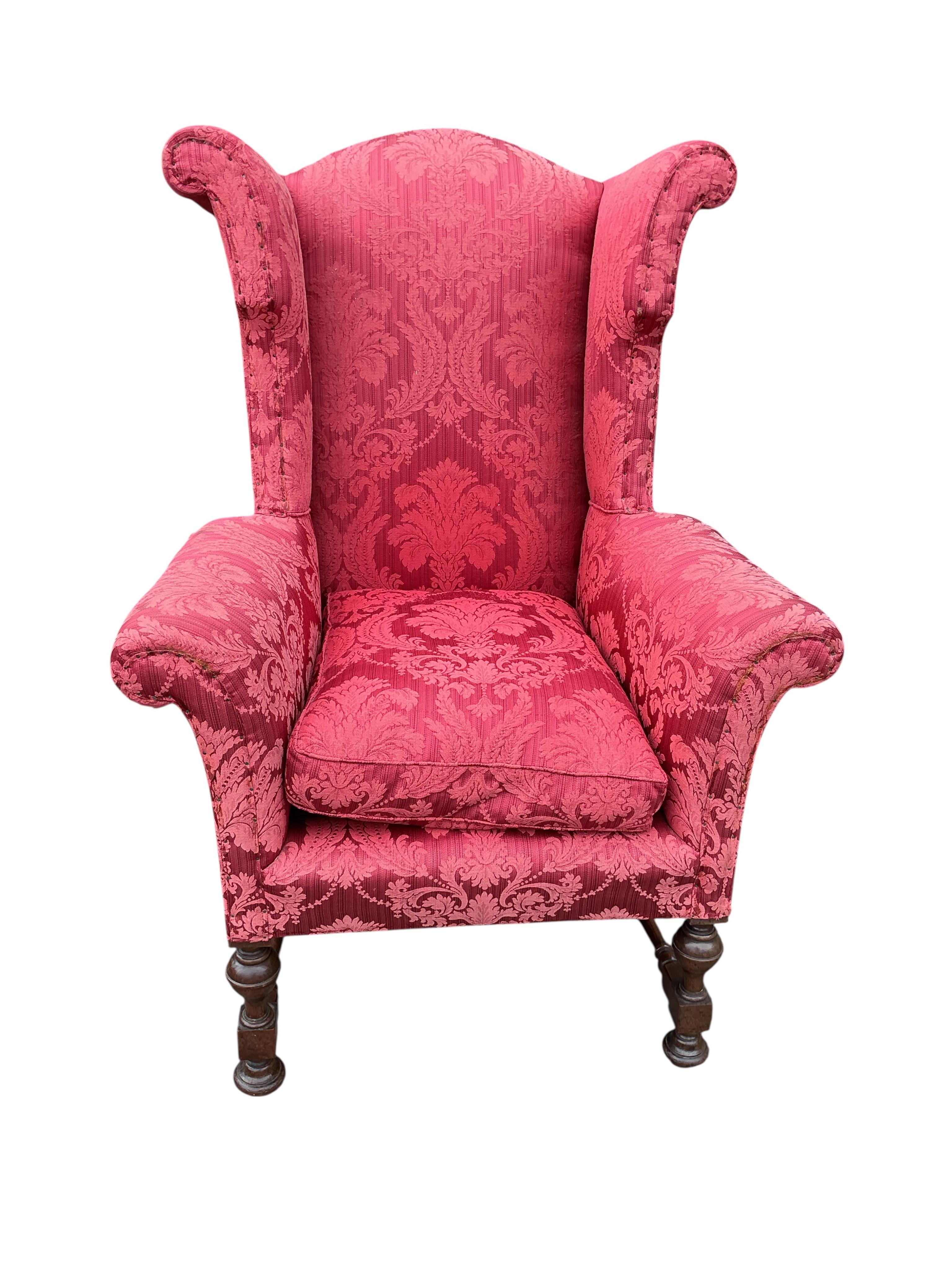 A pair of early 20th century Jacobean Revival upholstered wing armchairs, width 81cm, depth 75cm, height 127cm